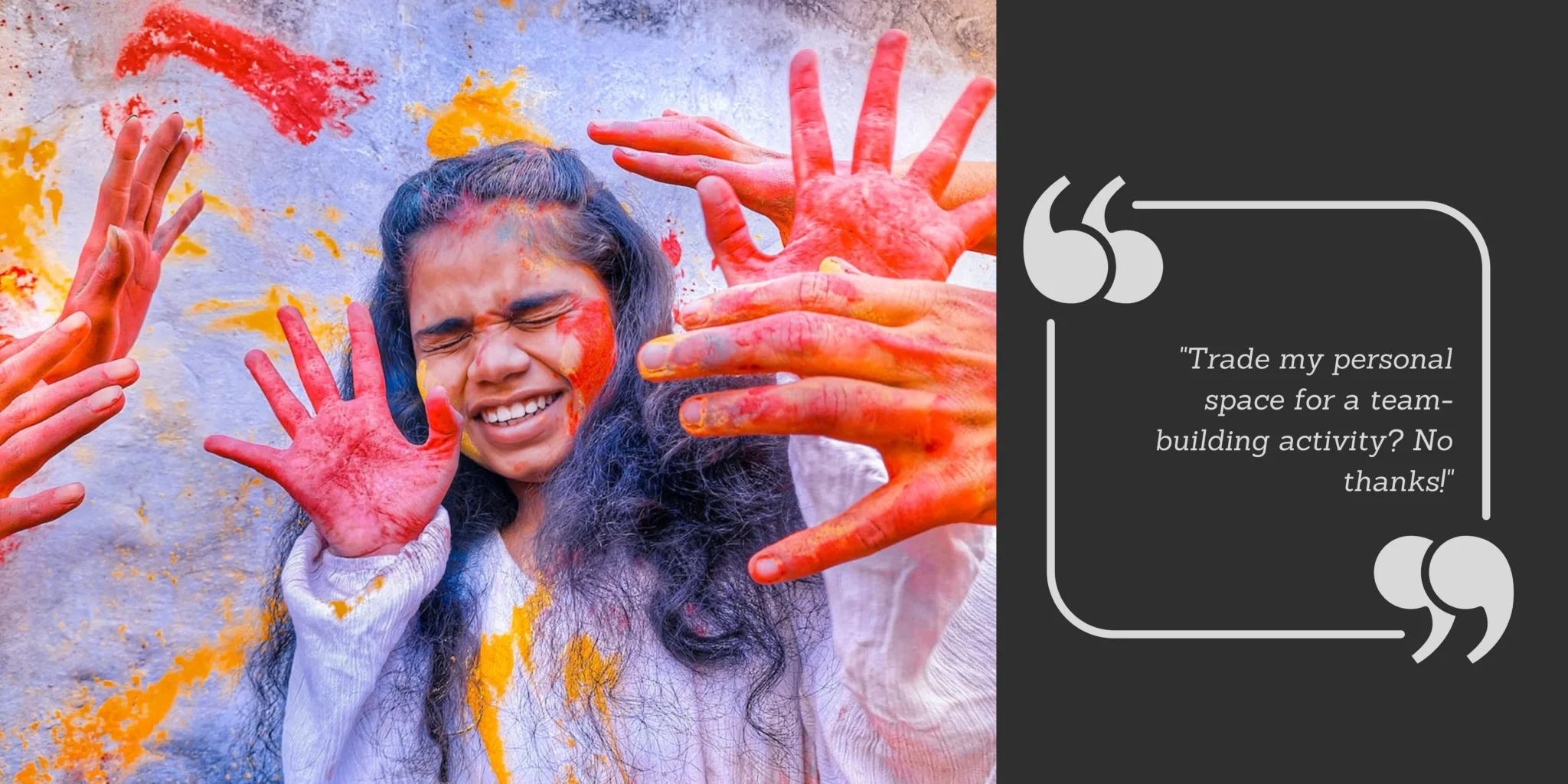 A young girl holding her hands up to her face when colour gets thrown at her